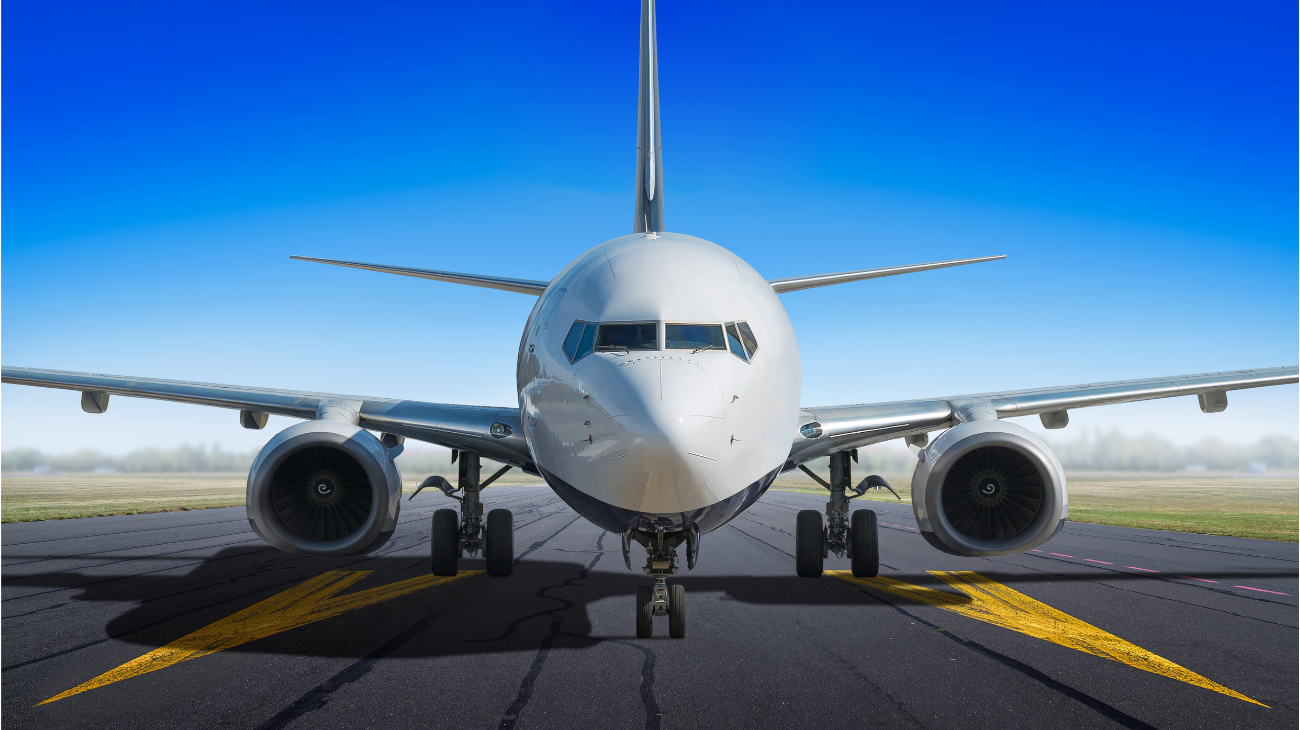 image of a white aircraft about to take off and fly